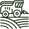 Close-up of a lime spreader machine in action on a farm.